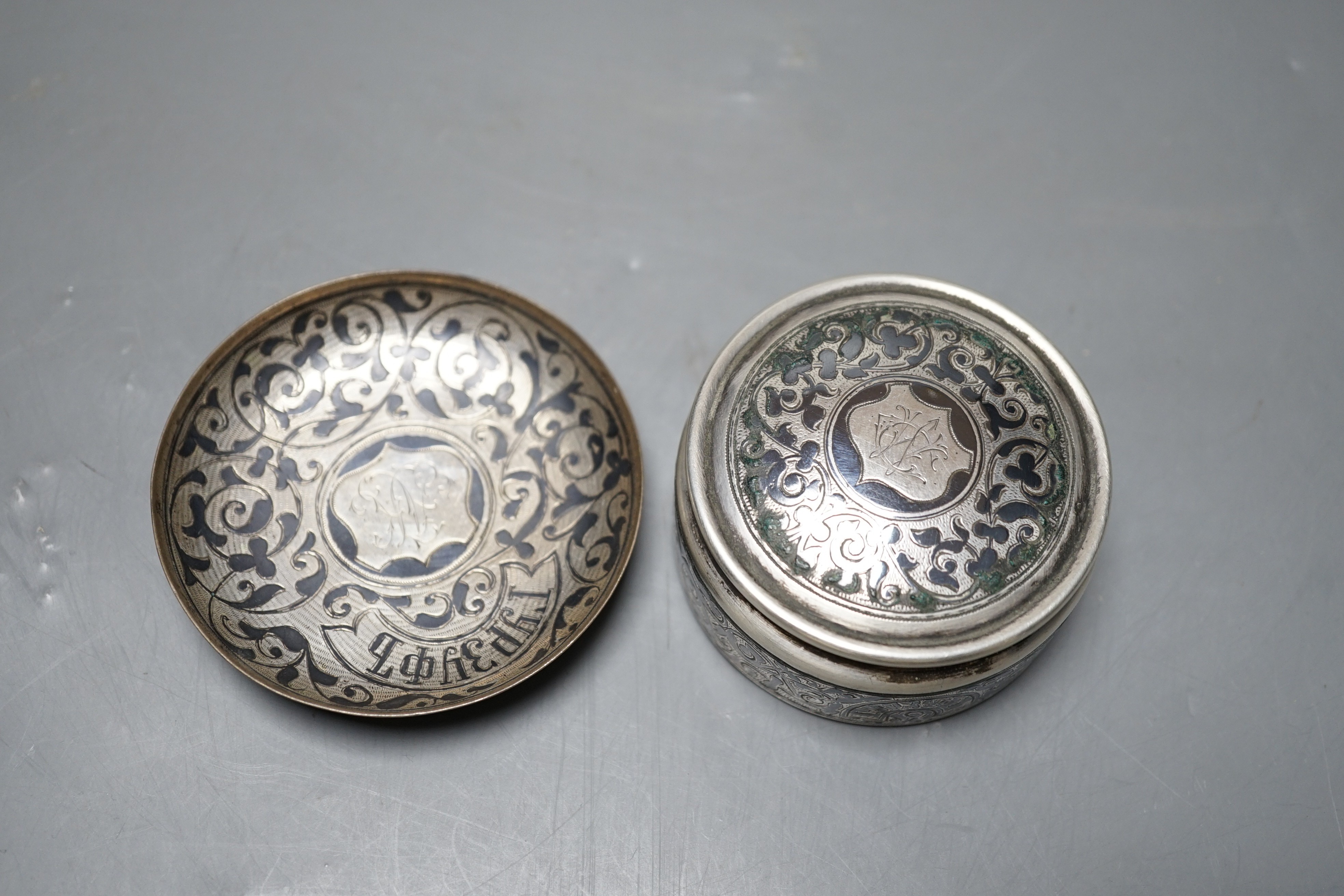 A late 19th/early 20th century Russian 84 zolotnik and niello part communion? set, comprising a pot and cover with dish, 73mm.